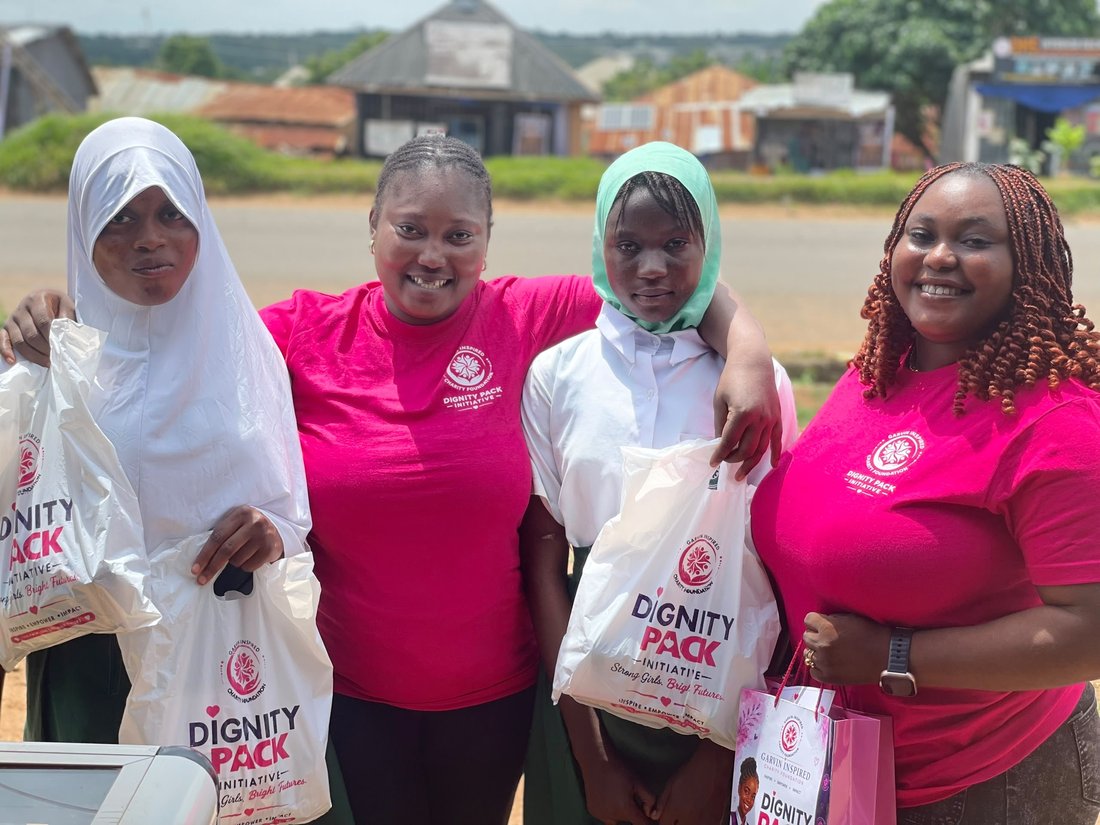 Volunteers distributing Dignity Pack kits roadside