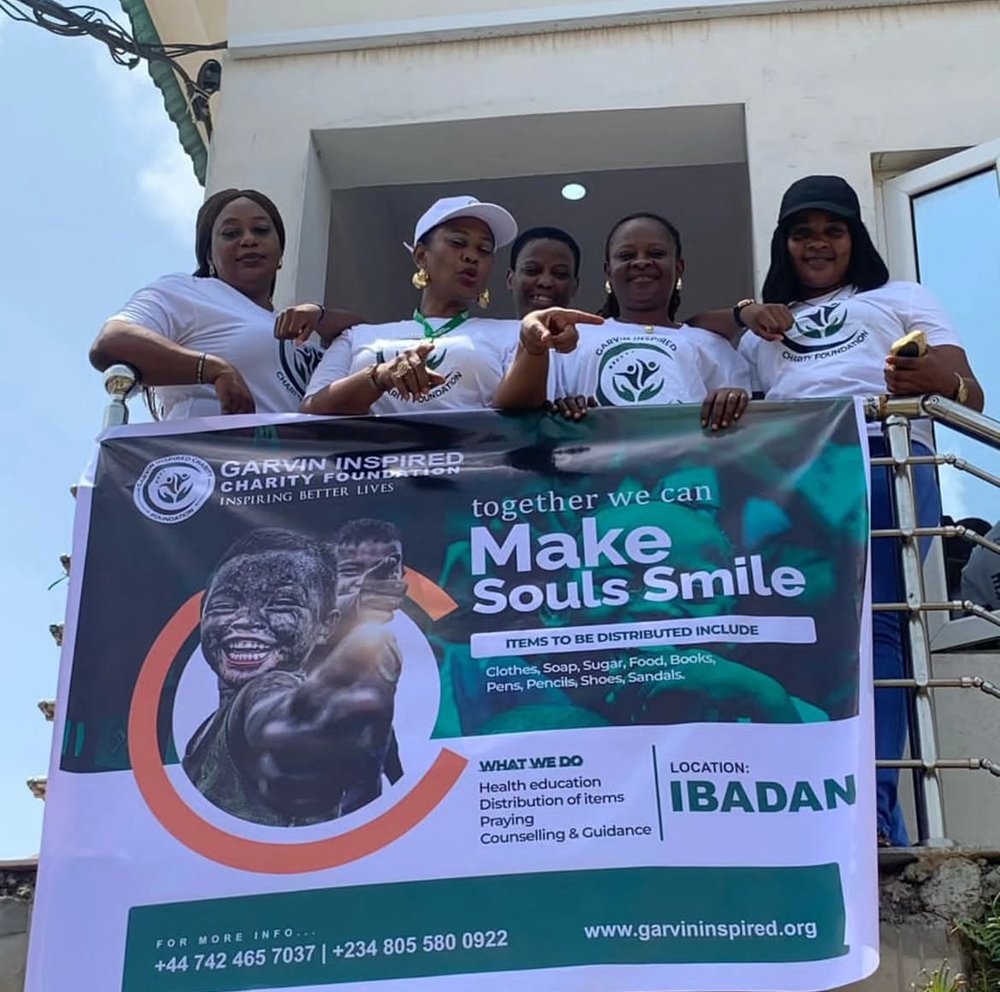 Garvin Inspired volunteer team with outreach banner